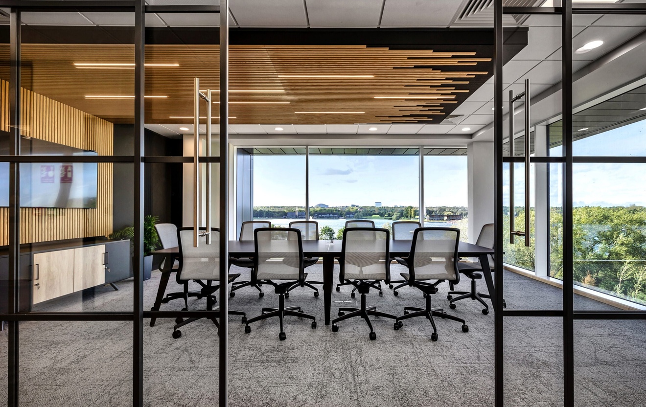 modern conference room with big glass windows, bespoke wooden features on feature wall and ceiling